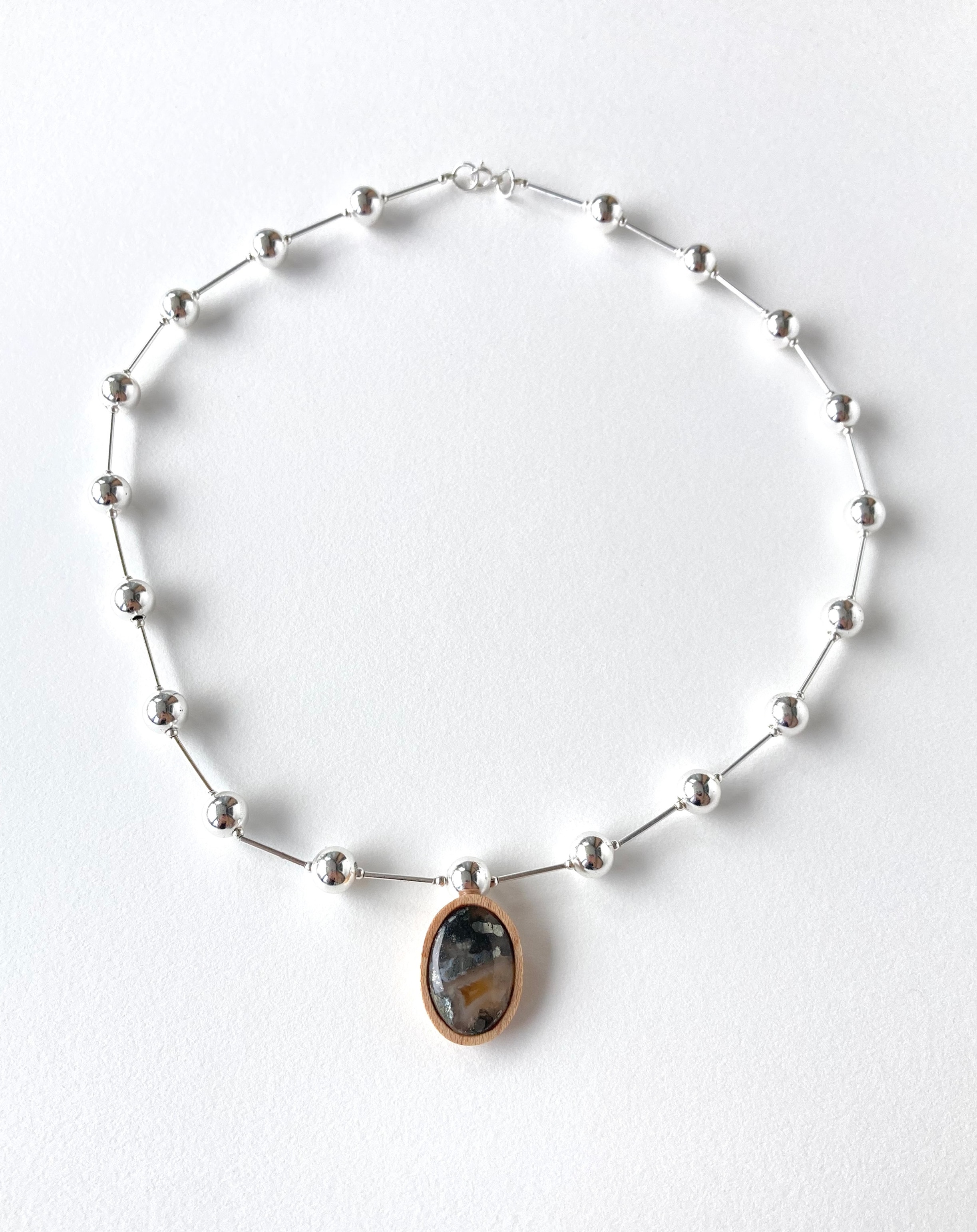Vintage sterling silver bead necklace with Nipomo agate gemstone in wooden bezel